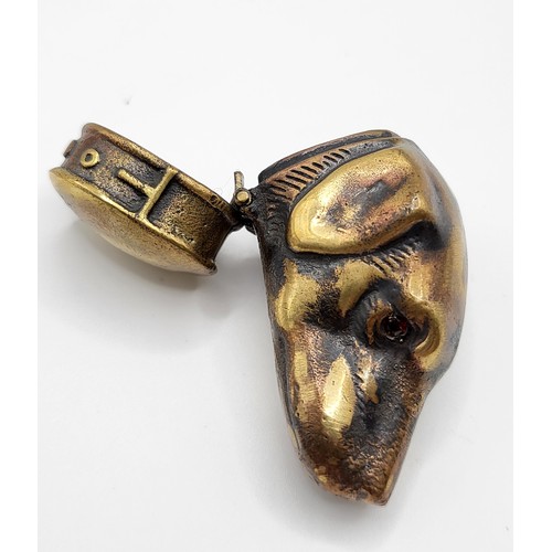 264 - A novelty brass vesta case in the form of a dog's head.