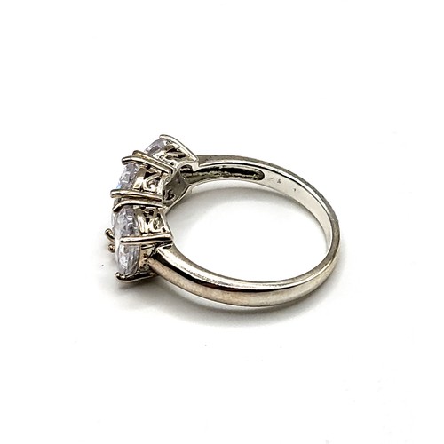 265 - A silver and cubic zirconia ring, set with three oval-cut cubic zirconias, size R 1/2.