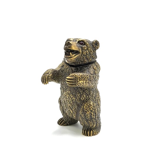 267 - A novelty brass vesta case in the form of a grizzly bear, with red eyes, 6.5 cm high.