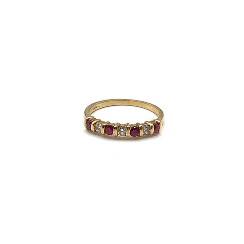 273 - A 9ct yellow gold, diamond, and ruby ring, bar set with three round-cut diamonds, and four round-cut... 