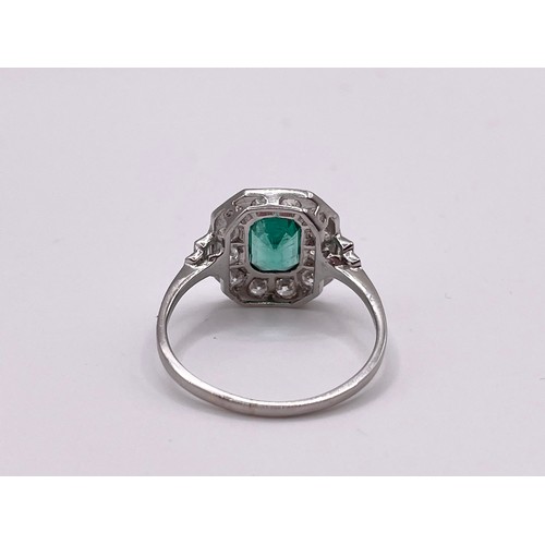 288 - A platinum, diamond, and emerald ring, set with an emerald-cut emerald of approximately 1.0 carats, ... 