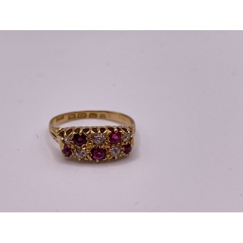 289 - A yellow gold ruby and diamond ring, set with four rubies and four diamonds.