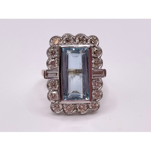 292 - A 14ct yellow gold, diamond, and aquamarine cocktail ring, set with a large baguette-cut aquamarine ... 