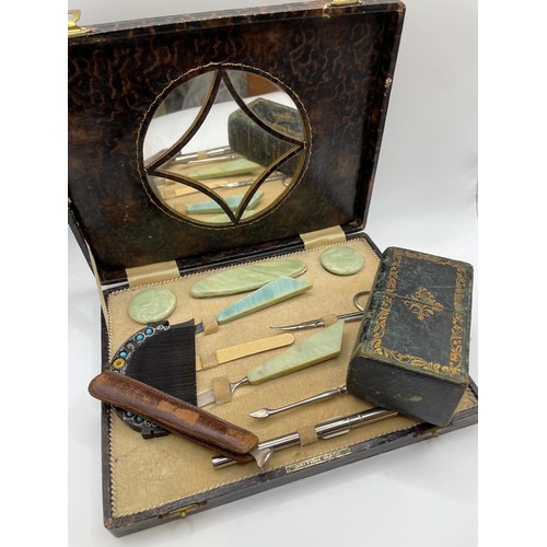 299 - A mid 20th century cased ladies vanity / manicure set with green resin handles, together with a late... 