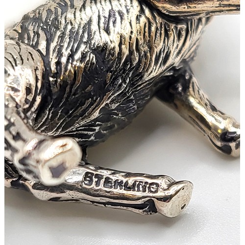 230 - A novelty silver model of a stag, with textured body, marked 'sterling' to leg, 3.7 cm long, 2.8 cm ... 