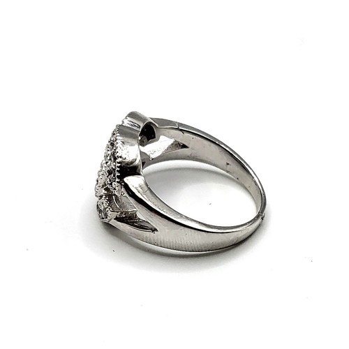 253 - A silver and cubic zirconia cocktail ring, in a designer style, marked 925, size O 1/2.