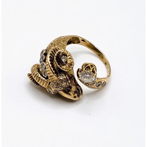 269 - An unusual Greek yellow gold and diamond ring in the form of a ram's head, set with ruby eyes and sm... 