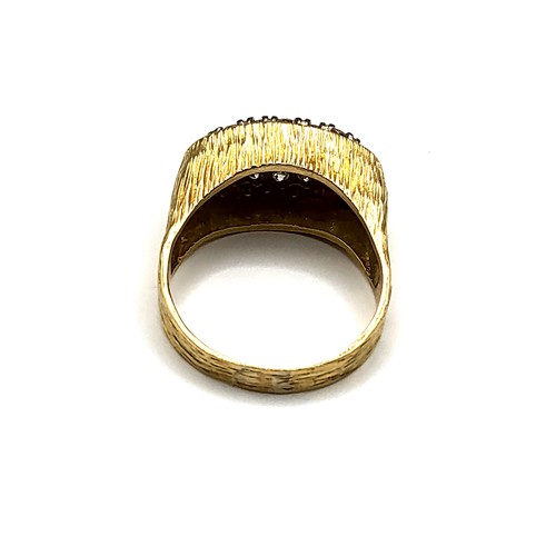 272 - A gentleman's yellow metal and diamond dress ring, set to the centre with five graduated emerald-cut... 