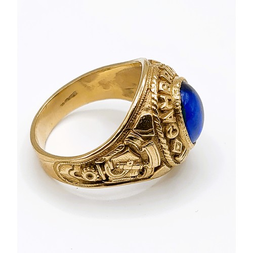 273 - A 9ct yellow gold and blue stone Cambridge University college ring, set with a blue glass cabochon, ... 