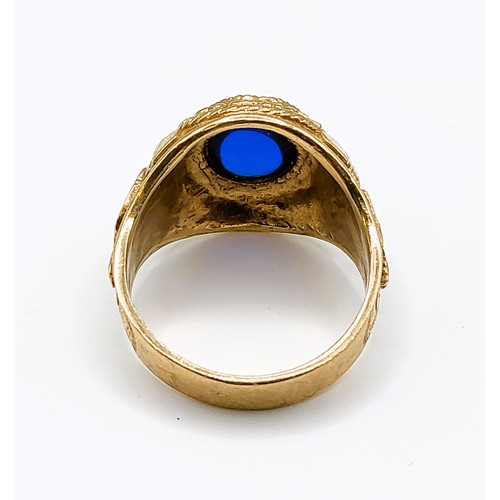 273 - A 9ct yellow gold and blue stone Cambridge University college ring, set with a blue glass cabochon, ... 