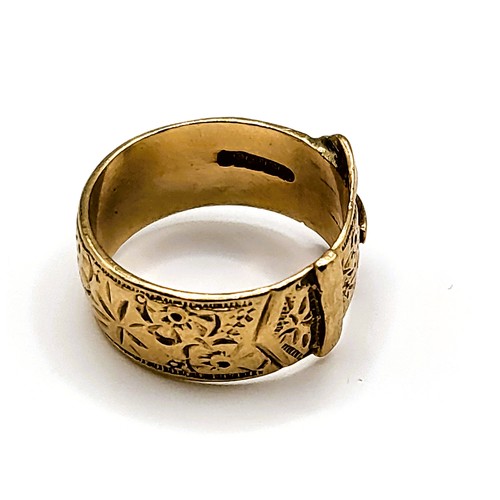 284 - A 9ct yellow gold buckle ring, with engraved decoration around shank, hallmarked to interior, size Q... 