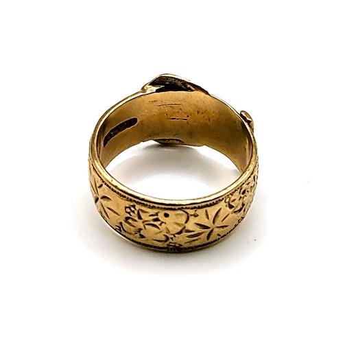 284 - A 9ct yellow gold buckle ring, with engraved decoration around shank, hallmarked to interior, size Q... 