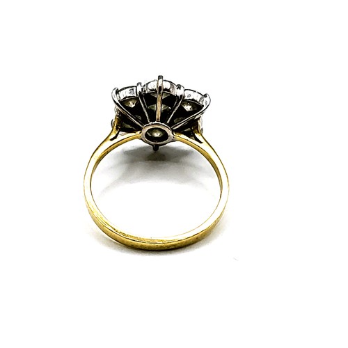 288 - An 18ct yellow gold and diamond floral cluster ring, set with seven round brilliant-cut diamonds, of... 