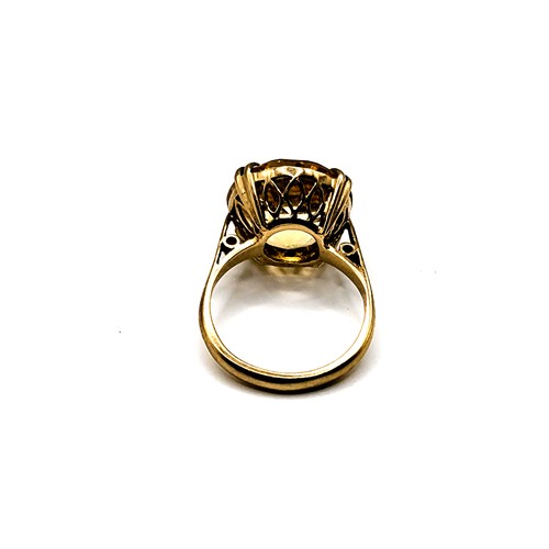 298 - A 9ct yellow gold and single stone citrine ring, set with a round-cut citrine measuring approximatel... 