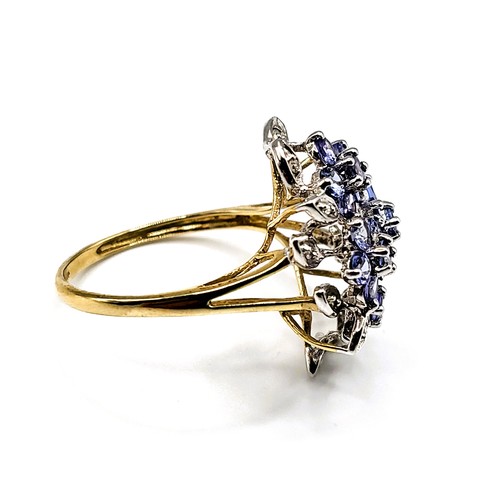 299 - A 9ct yellow gold, diamond, and tanzanite cluster ring, size R.