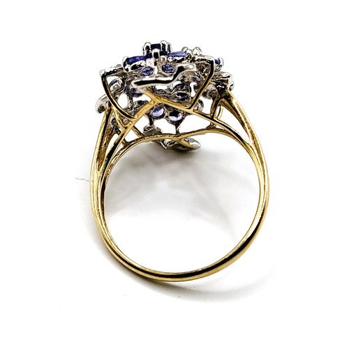 299 - A 9ct yellow gold, diamond, and tanzanite cluster ring, size R.