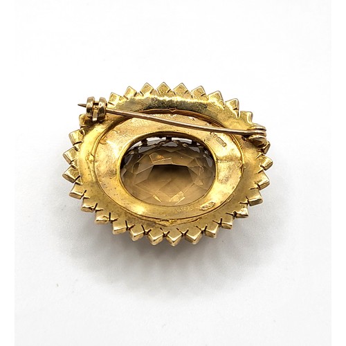 309 - A 9ct yellow gold, smoky quartz, and pearl Victorian style brooch, of oval design, set with a mixed ... 