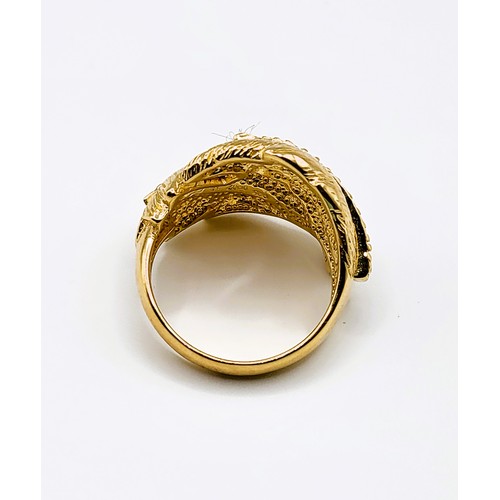 313 - A silver gilt and cubic zirconia double feather design cocktail ring, together with a matching pair ... 