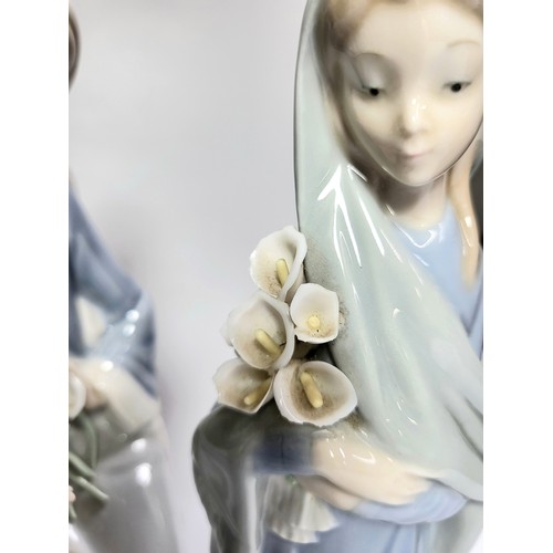 159 - Two Lladro girl figures with flowers (one with minor chip) both 23cm, and girl with duck (slight chi... 