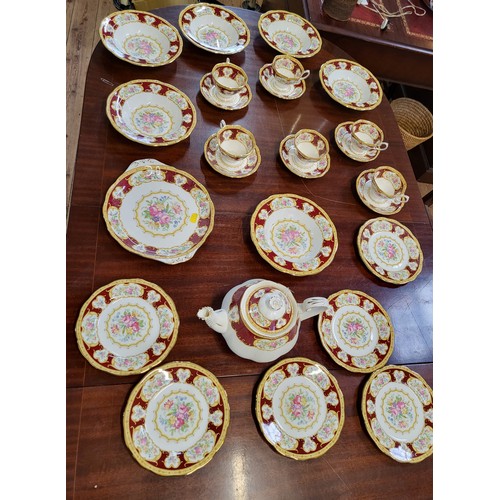 166 - A Royal Albert 'Lady Hamilton' pattern comprising teapot, six bowls, six cups with saucers, cake dis... 