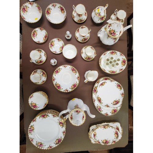 168 - A Royal Doulton 'Old Country Roses' dinner, coffee and tea set, and eight glass pepper pots. (53)(Co... 