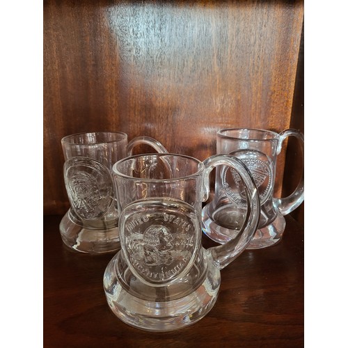 175 - A group of Dartington glass mugs, various dates.