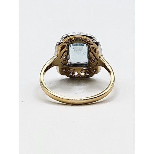 324 - A yellow metal, diamond, and aquamarine ring, (unmarked, tests as 15ct gold), set with a rectangular... 