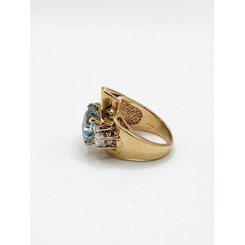 325 - A 14k yellow gold, diamond and aquamarine ring, set with a cushion-cut aquamarine, the asymmetric sc... 