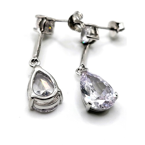 337 - A pair of cubic zirconia drop earrings marked 925, and butterflies, boxed. Rhodium plated silver.