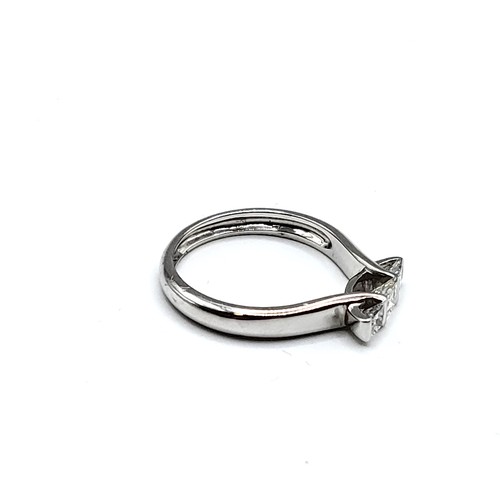 341 - An 18ct white gold and diamond ring, set with three princess cut diamonds of approximately 0.50 cara... 