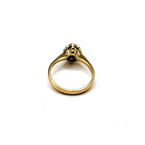 342 - An 18ct yellow gold and diamond cluster ring, the marquise shaped mount inset with a bezel-set round... 