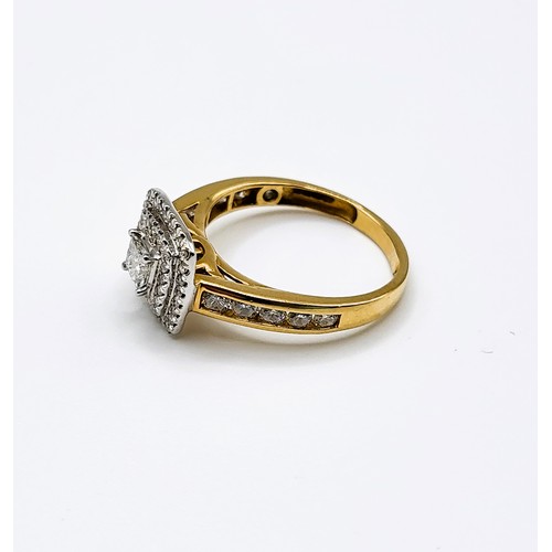 343 - An 18ct yellow gold and diamond halo cluster ring, centred with a princess cut diamond within a trip... 