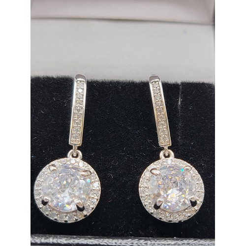 344 - Cubic Zirconia Halo drop earrings hook fittings mark 925 Rhodium plated, boxed.