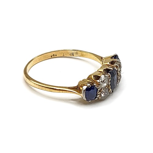 354 - An 18ct yellow gold, diamond, and sapphire ring, set with three mixed oval-cut sapphires, and four o... 