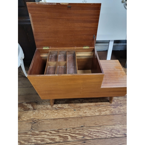 45 - A mid-century wooden sewing box, hinged lid and fitted drawers. 56cm x 76cm