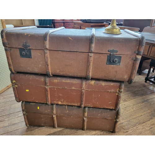 117 - Three vintage brown leather suitcases, (approx. 32cm x 91cm x 56cm each) together with an oil lamp