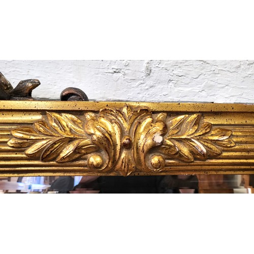 56 - A large gilt bevelled wall mirror, 141cm x 97cm.