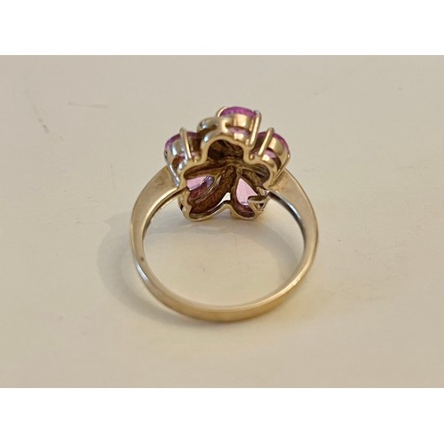 390 - A 9ct yellow gold and pink sapphire cluster ring, set with five pear-cut pink sapphires, size M 1/2.