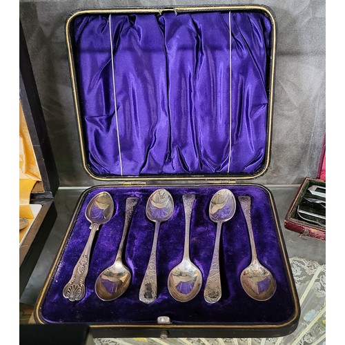 224 - A collection of silver and silver plate items presented complete in display cases including a Harrod... 