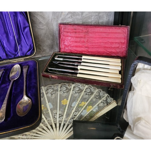 224 - A collection of silver and silver plate items presented complete in display cases including a Harrod... 