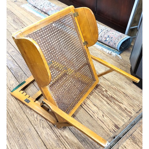 124 - A vintage wood framed bedrest with rattan back, together with a wheelchair/ carry chair