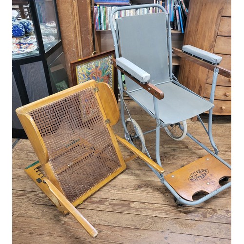 124 - A vintage wood framed bedrest with rattan back, together with a wheelchair/ carry chair