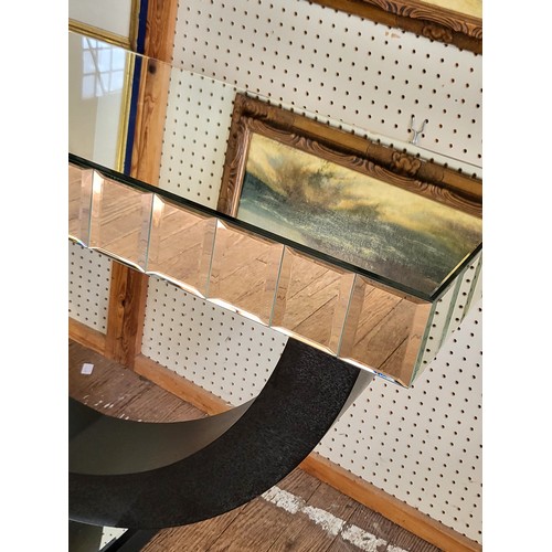 56 - A mirrored console table with U-shaped base. 83cm x 137cm x 41cm.