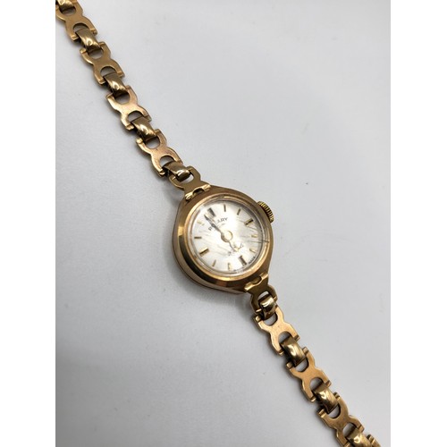 369 - A 9ct yellow gold ladies Rotary wristwatch, with round baton dial, on fancy-link 9ct yellow gold str... 