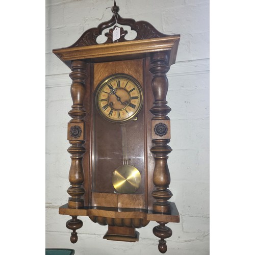 64 - A walnut cased wall clock