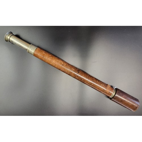 65 - A brass and leather telescope by T. Cooke & Sons Ltd, London and York, no. 7641, with silvered finis... 