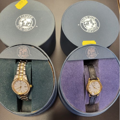 375 - Two ladies Citizen Eco Drive watches in presentation cases, both date just, one on a leather strap, ... 