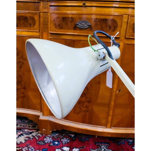 34 - A cream-coloured angle-poise lamp.