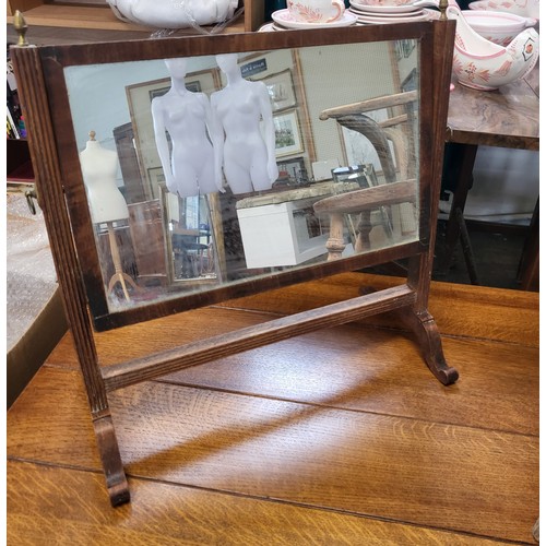 30 - A mahogany dressing table mirror on a stand, the stand with brass finials and fluted column decorati... 