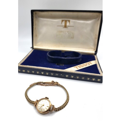 398 - A Tissot 9ct gold ladies watch on an articulated bracelet and safety chain in the
original presentat... 